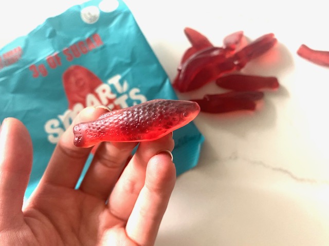 Holding a Smart Sweets sweet fish